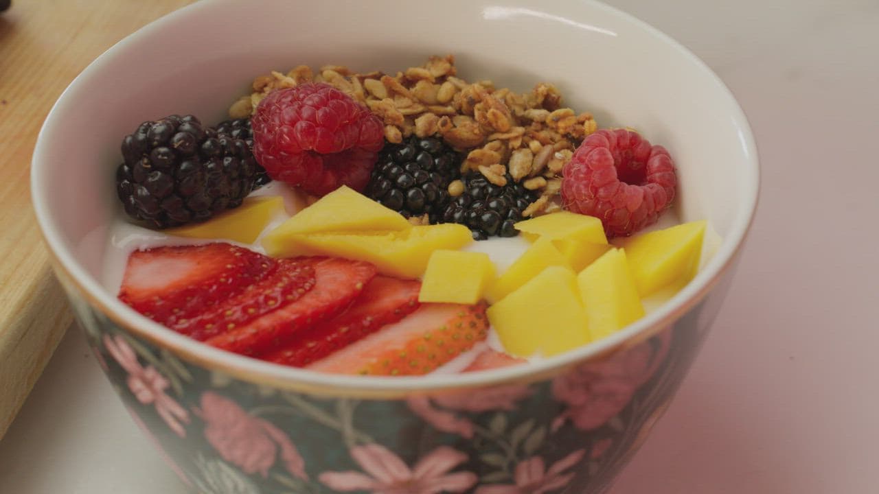 Yogurt bowl with fresh berries, mango and granola